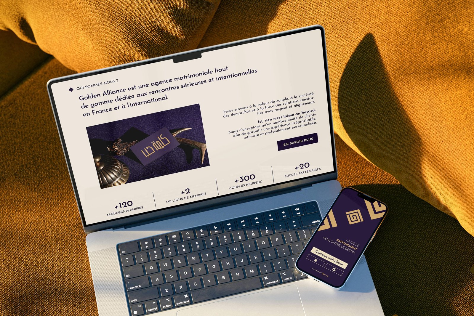Ordinateur portable et smartphone présentant Golden Alliance